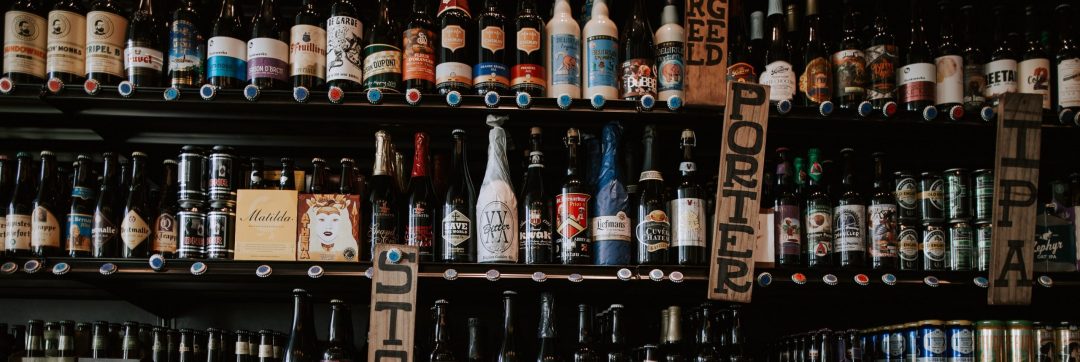 Image of a large shelf of alcoholic beverages