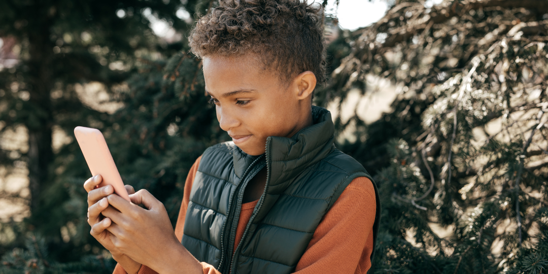 A child looking at a cellphone